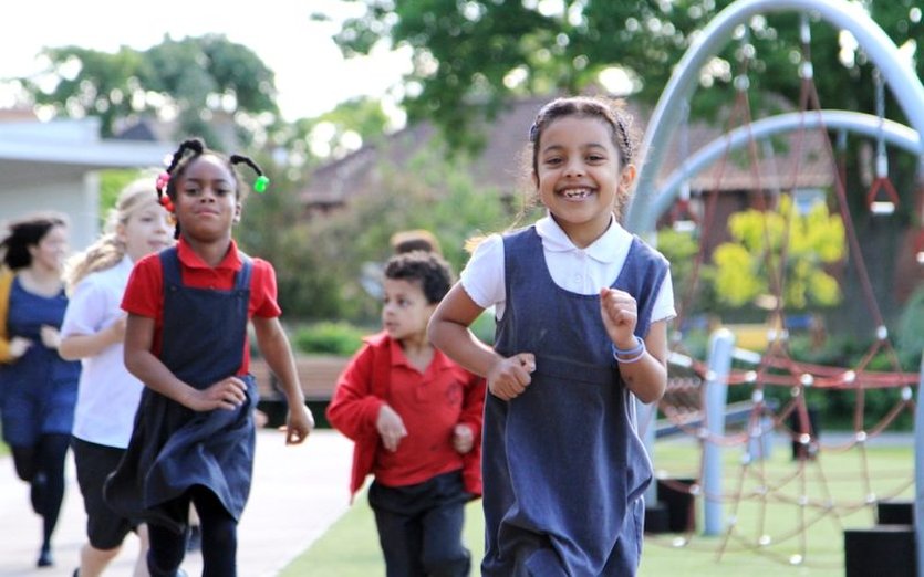 School children running and playing