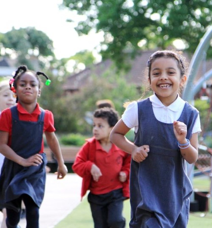 School children running and playing
