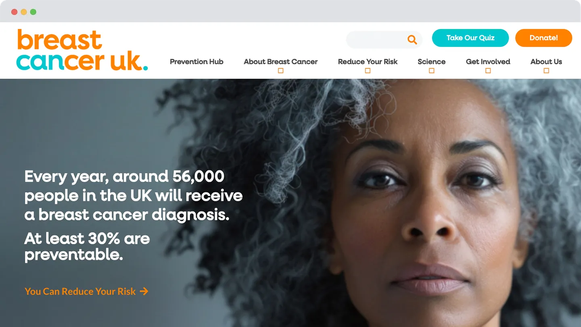 The previous Breast Cancer UK homepage featuring a full-width image of a woman with grey curly hair and statistics about breast cancer diagnosis.