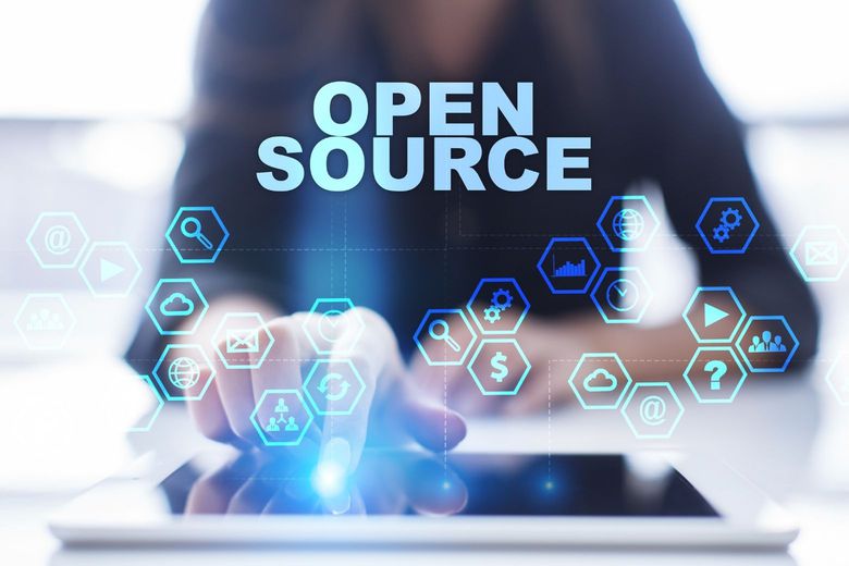 person in front of a display that says opensource