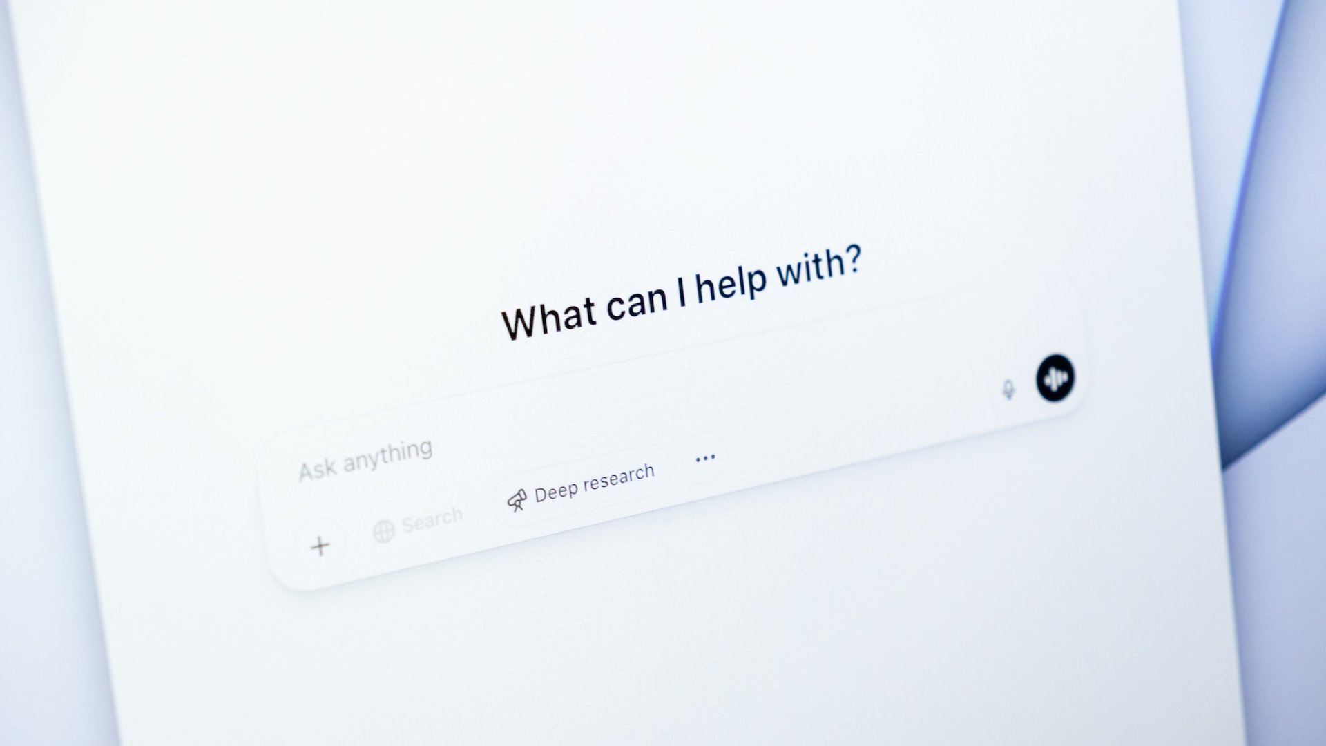 Close-up of a screen displaying the ChatGPT interface with the prompt "What can I help with?" and options for asking questions, representing AI-assisted search or support.