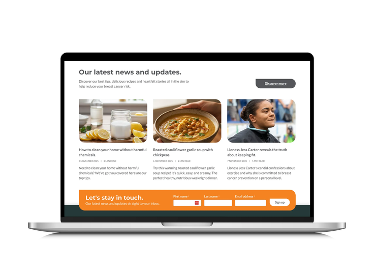 A laptop displaying Breast Cancer UK’s news and updates section with articles, recipes, and a newsletter signup form.